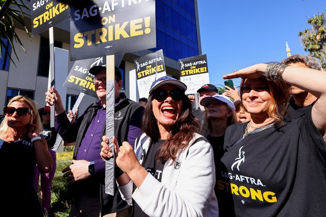 SAG-AFTRA union President Fran Drescher and Duncan Crabtree-Ireland, SAG-AFTRA National Executive Director and Chief Negotiator, demonstrate as SAG-AFTRA actors join the Writers Guild of America (WGA) in a strike against the Hollywood studios, on the picket like outside of Netflix offices in Los Angeles, California, U.S., July 14, 2023. (Photo by Mike Blake/Reuters)