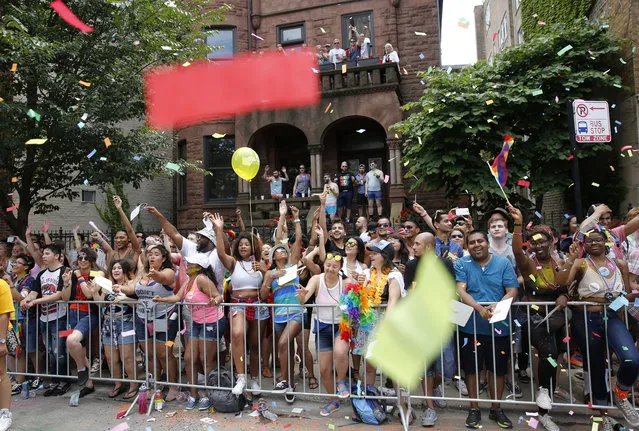Confetti falls on parade-goers at the 47th annual Chicago Pride parade on Sunday, June 26, 2016 on Belmont Avenue in Chicago. (Photo by Michael Tercha/Chicago Tribune)
