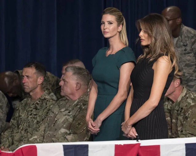 Ivanka Trump, the daughter of President Donald Trump, and first lady Melania Trump stand together before President Donald Trump arrives to speak at Fort Myer in Arlington Va., Monday, August 21, 2017, during a Presidential Address to the Nation about a strategy he believes will best position the U.S. to eventually declare victory in Afghanistan. (Photo by Carolyn Kaster/AP Photo)