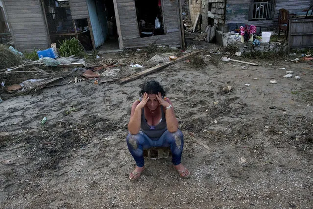 A despondent Mariela Leon sits in front of her flood damaged home after the passing of Hurricane Irma, in Isabela de Sagua, Cuba, Monday, September 11, 2017. Cuban state media reported 10 deaths despite the country's usually rigorous disaster preparations. More than 1 million were evacuated from flood-prone areas. (Photo by Ramon Espinosa/AP Photo)