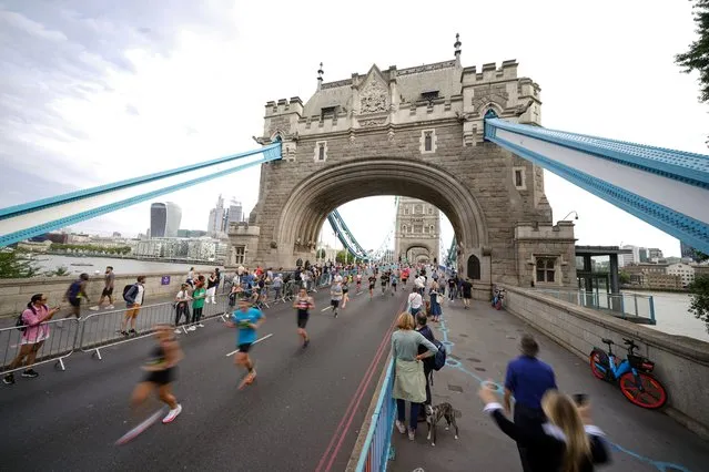 Runner going over Tower Bridge during The Big Half, which runs from Tower Bridge to Greenwich, London on Sunday, September 4, 2022. (Photo by Yui Mok/PA Images via Getty Images)