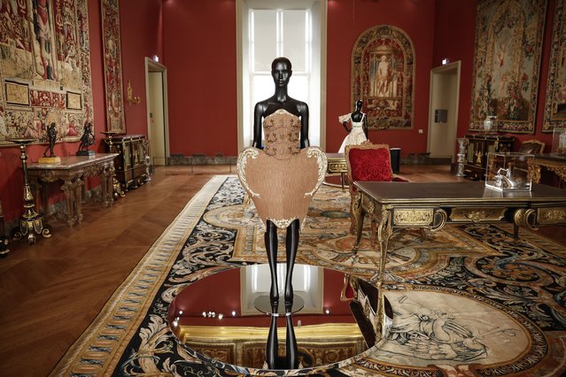 A creation from the Autumn/Winter 2022/2023 ready-to-wear collection by US designer Jeremy Scott for Moschino fashion house is on display during the exhibition “Louvre Couture, Art and fashion: statement pieces” at the Louvre museum in Paris, France, 23 January 2025. The exhibition runs from 24 January to 21 July 2025. (Photo by Yoan Valat/EPA/EFE)