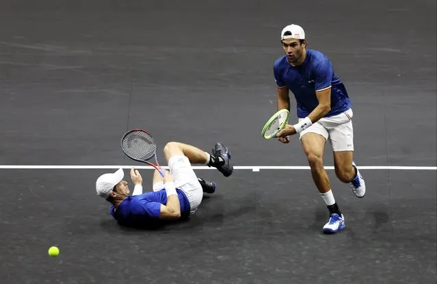 Matteo Berrettini of Team Europe plays a forehand shot as Andy Murray of Team Europe slips during the match between Matteo Berrettini and Andy Murray of Team Europe and Felix Auger-Aliassime and Jack Sock of Team World during Day Three of the Laver Cup at The O2 Arena on September 25, 2022 in London, England. (Photo by Clive Brunskill/Getty Images for Laver Cup)