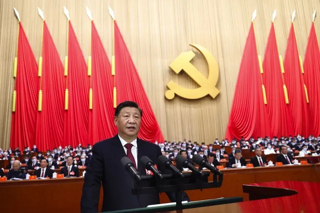 In this photo released by Xinhua News Agency, Chinese President Xi Jinping delivers a speech during the opening ceremony of the 20th National Congress of China's ruling Communist Party in Beijing, China, Sunday, October 16, 2022. China on Sunday opens a twice-a-decade party conference at which leader Xi Jinping is expected to receive a third five-year term that breaks with recent precedent and establishes himself as arguably the most powerful Chinese politician since Mao Zedong. (Photo by Ju Peng/Xinhua via AP Photo)