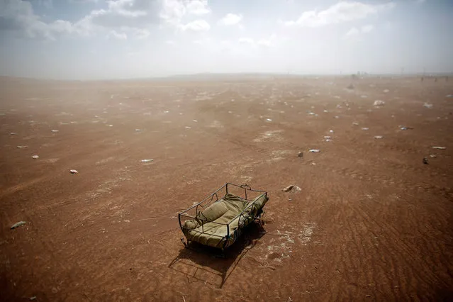 A cradle left behind by Syrian Kurdish refugees lies at the Turkish-Syrian border near the southeastern town of Suruc in Sanliurfa province September 27, 2014. Turkish troops could be used to help set up a secure zone in Syria, if there was an international agreement to establish such a haven for refugees fleeing Islamic State fighters, President Tayyip Erdogan said in comments published on Saturday. (Photo by Murad Sezer/Reuters)