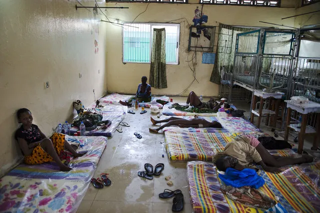 Inside the critical ward of the Redemption  Hospital which has become a transfer and holding center  to an intake suspected Ebola patients located in the poor neighborhood of Monrovia that locals call “New Kru Town” on Saturday September 20, 2014 in Monrovia, Liberia. (Photo by Michel du Cille/The Washington Post)