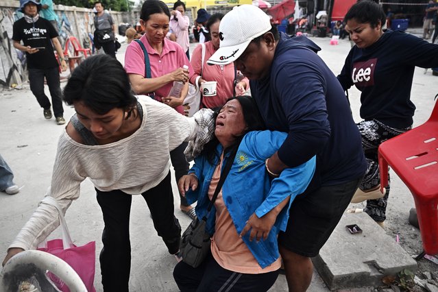 A woman reacts while waiting for news of missing loved ones at the site of an under-construction building collapse in Bangkok on March 30, 2025, two days after an earthquake struck central Myanmar and Thailand. The death toll from a huge earthquake that hit Myanmar and Thailand passed 1,600, as rescuers dig through the rubble of collapsed buildings in a desperate search for survivors. (Photo by Lillian Suwanrumpha/AFP Photo)