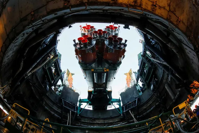 The Soyuz MS-07 spacecraft for the next International Space Station (ISS) crew formed of Norishige Kanai of Japan, Anton Shkaplerov of Russia and Scott Tingle of the U.S. is seen being set at the launchpad ahead of its upcoming launch, at the Baikonur Cosmodrome, Kazakhstan December 15, 2017. (Photo by Shamil Zhumatov/Reuters)