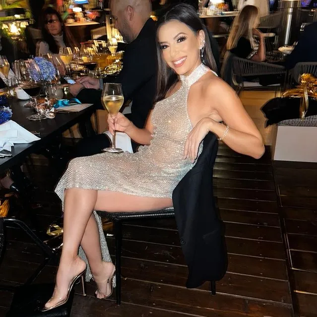 American actress Eva Longoria in the last decade of December 2022. The “Desperate Housewives” star looked anything but desperate in this sheer, sparkling halter dress with a hip-high slit. (Photo by evalongoria/Instagram)