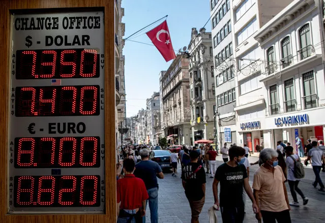 People wearing face masks walk in front of an exchange office at the Taksim square in Istanbul, Turkey, 03 September 2020. According to reports, the Turkish Lira fell to a fresh record low on 03 September against major currencies, recording 7.44 liras against the US dollar and 8.80 to the Euro. (Photo by Erdem Sahin/EPA/EFE/Rex Features/Shutterstock)