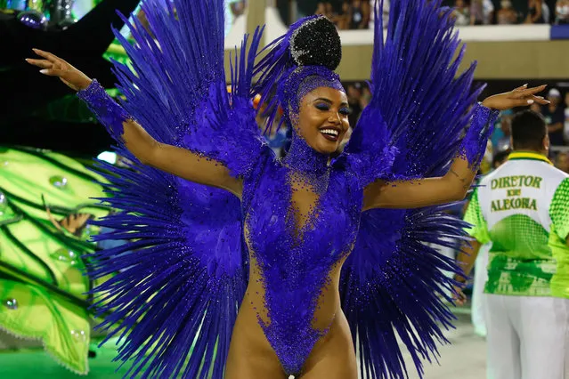 A reveller of the Imperatriz Leopoldinense samba-swing school performs during the first night of Rio's Carnival at the Sambadrome in Rio, Brazil, on February 12, 2018. (Photo by Gilson Borba/NurPhoto via Getty Images)