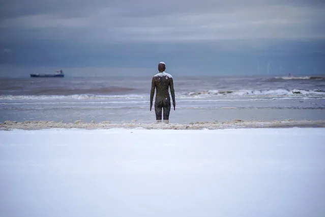 Snow covers the beach and a statue at Antony Gormley's art installation 'Another Place' at Crosby Beach on February 27, 2018 in Liverpool, United Kingdom. Freezing weather conditions dubbed the “Beast from the East” brings snow and sub-zero temperatures to the UK.  (Photo by Christopher Furlong/Getty Images)