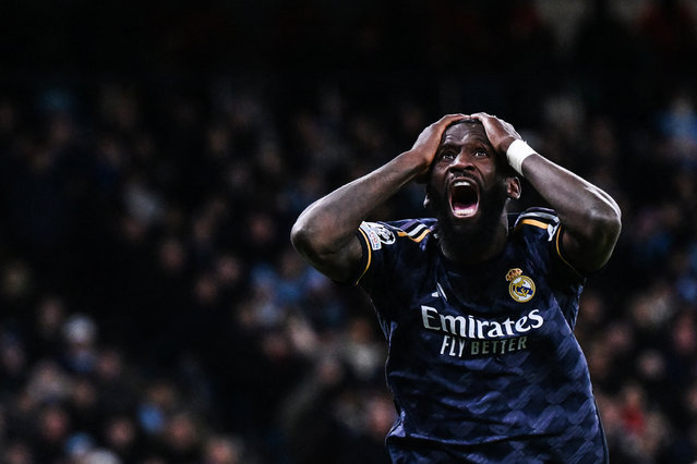 Real Madrid's German defender #22 Antonio Rudiger reacts following a missed chance during the UEFA Champions League quarter-final second-leg football match between Manchester City and Real Madrid, at the Etihad Stadium, in Manchester, north-west England, on April 17, 2024. (Photo by Paul Ellis/AFP Photo)