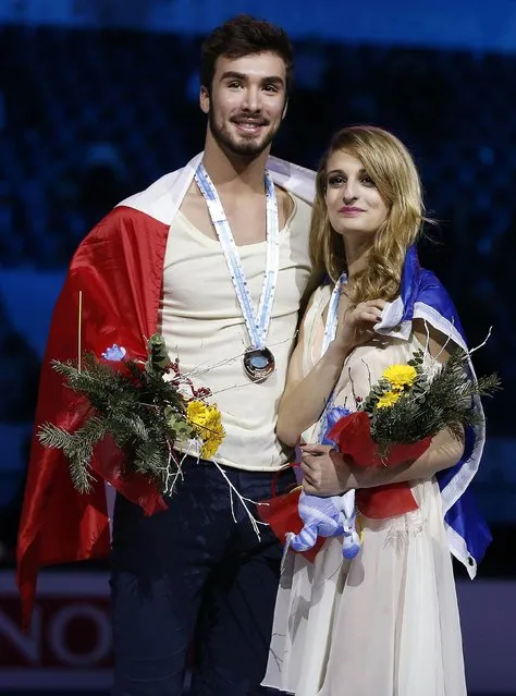 Gabriella Papadakis and Guillaume Cizeron of France pose with their bronze medals during an award ceremony after placing third in the Ice Dance final competition at the ISU Grand Prix of Figure Skating final in Barcelona December 13, 2014. (Photo by Gustau Nacarino/Reuters)