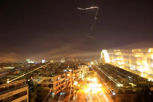 Damascus is seen as the U. S. launches an attack on Syria targeting different parts of the capital early Saturday, April 14, 2018. (Photo by Hassan Ammar/AP Photo)