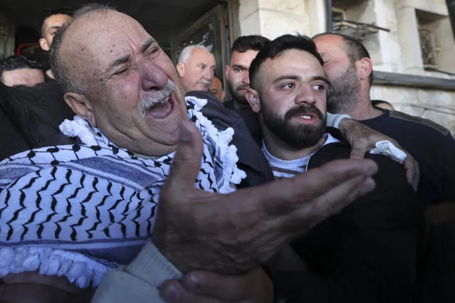 The father of Mohammed Abu Bakr, who was killed during clashes with the Israeli army, outside the Rafidiya hospital in the city of Nablus in the occupied West Bank on April 3, 2023. (Photo by Jaafar Ashtiyeh/AFP Photo)