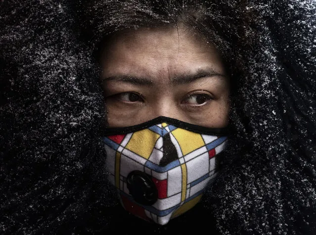 A Chinese woman wears a protective mask as she shops in a market on February 6, 2020 in Beijing, China. The number of cases of a deadly new coronavirus rose to more than 28000 in mainland China Thursday, days after the World Health Organization (WHO) declared the outbreak a global public health emergency. China continued to lock down the city of Wuhan in an effort to contain the spread of the pneumonia-like disease which medicals experts have confirmed can be passed from human to human. In an unprecedented move, Chinese authorities have put travel restrictions on the city which is the epicenter of the virus and municipalities in other parts of the country affecting tens of millions of people. The number of those who have died from the virus in China climbed to over 564 on Thursday, mostly in Hubei province, and cases have been reported in other countries including the United States, Canada, Australia, Japan, South Korea, India, the United Kingdom, Germany, France and several others. The World Health Organization has warned all governments to be on alert and screening has been stepped up at airports around the world. Some countries, including the United States, have put restrictions on Chinese travelers entering and advised their citizens against travel to China. (Photo by Kevin Frayer/Getty Images)