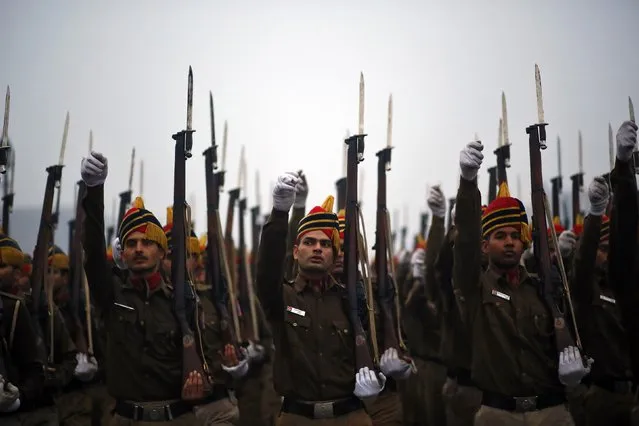 Indian policemen rehearse for the Republic Day parade amid dense fog on a cold winter morning in New Delhi January 2, 2015. (Photo by Anindito Mukherjee/Reuters)
