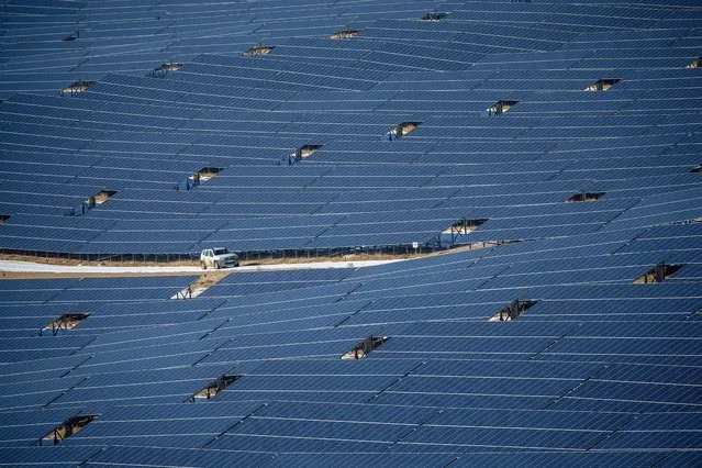 A drone photo shows an aerial view of solar panels at a solar energy power plant (GES) in Edremit district of Van, Turkey on January 6, 2021. Van becomes one of the major markets of the country in electric generation from the sun with 37 megawatts of total capacity solar energy power plant to supply power to 80 thousand households. (Photo by Ozkan Bilgin/Anadolu Agency via Getty Images)