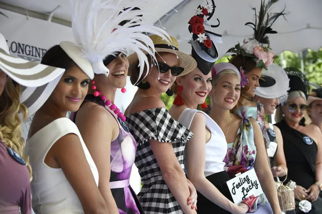 Contestants smile during the Longines Prize for Elegance fashion contest, Saturday, June 9, 2018, at Belmont Park in Elmont, N.Y. Longines, the Swiss watchmaker known for its elegant timepieces, is the Official Timekeeper and Watch of the 150th running of the Belmont Stakes. (Photo by Diane Bondareff/AP Images for Longines)