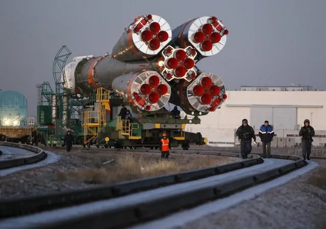 The Soyuz TMA-19M is transported from an assembling hangar to its launchpad at the Baikonur cosmodrome, Kazakhstan, December 13, 2015. (Photo by Shamil Zhumatov/Reuters)