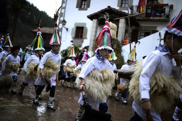 Dancers parade through Zubieta during carnival celebrations, January 27, 2015. (Photo by Vincent West/Reuters)
