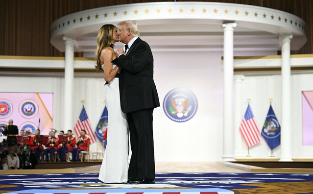 US President Donald Trump and First Lady Melania Trump dance on The Battle Hymn of the Republic during the Commander-In-Chief inaugural ball at the Walter E. Washington Convention Center in Washington, DC, on January 20, 2025. (Photo by Jim Watson/AFP Photo)