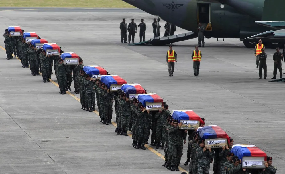 Bodies of 42 Elite Cops Arrive at Villamor Air Base