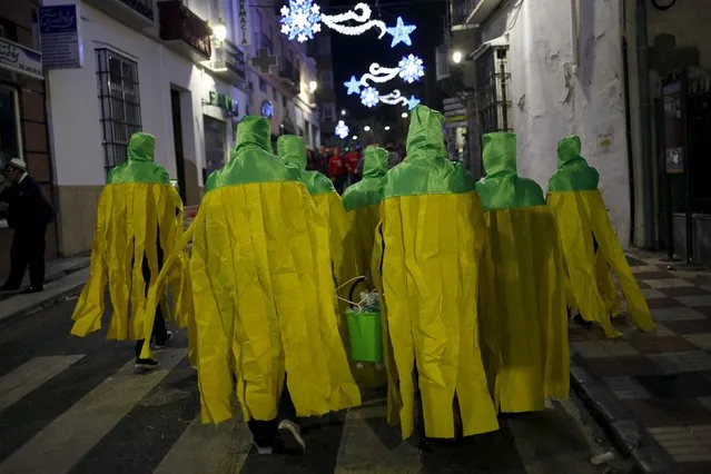 Revellers dressed up as mops take part in New Year celebrations in Coin, near Malaga, southern Spain, January 1, 2016. (Photo by Jon Nazca/Reuters)