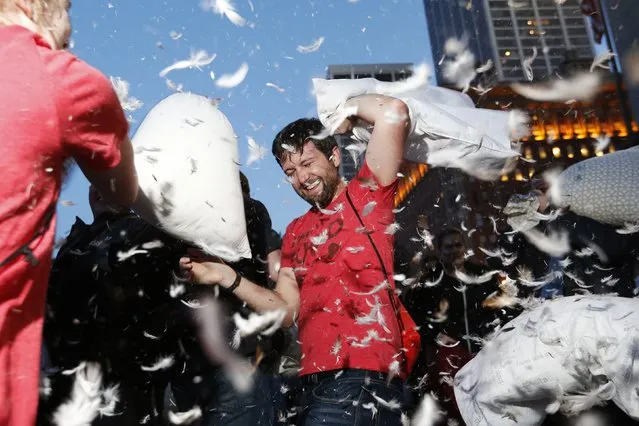 A participant swings his pillow during The Great San Francisco Valentine's Day Pillow Fight, in San Francisco, February 14, 2015. (Photo by Stephen Lam/Reuters)