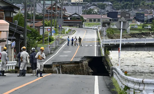 A collapsed road near the Saji River is pictured in Tottori, western Japan, after Typhoon Lan hit the region in this photo taken by Kyodo on August 16, 2023.  (Photo by Kyodo News via Reuters)