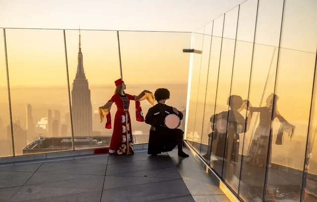 The representatives of “Caucasus Association Of America” perform Caucasian Dance during sunset at The Edge NYC building, the tallest observation terrace in New York, United States on October 5, 2023. The association, which includes Turks, Azerbaijanis and Circassians from all over the world, organized an event to promote the traditional Caucasian Dance in New York. (Photo by Fatih Aktas/Anadolu Agency via Getty Images)