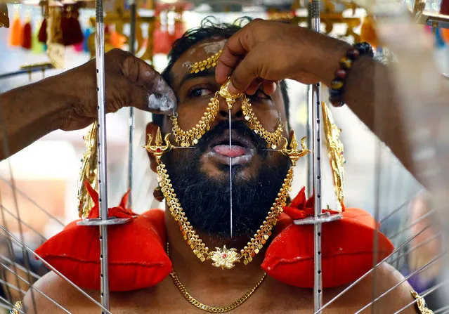 A devotee has his tongue pierced during the Thaipusam festival in Singapore, January 21, 2019. Thaipusam is a Hindu festival observed on the day of the full moon during the Tamil calendar month of Thai, and celebrated in honour of the Hindu god Lord Murugan. (Photo by Feline Lim/Reuters)