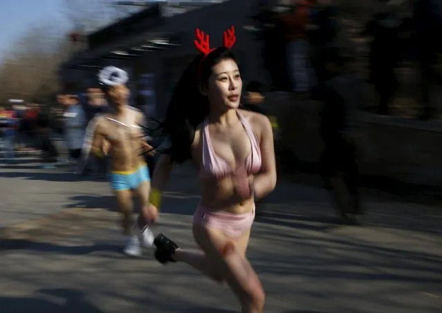 Participants run at the “Half-Naked Marathon” at Olympic Forest park in Beijing, China, February 28, 2016 (Photo by Kim Kyung-Hoon/Reuters)
