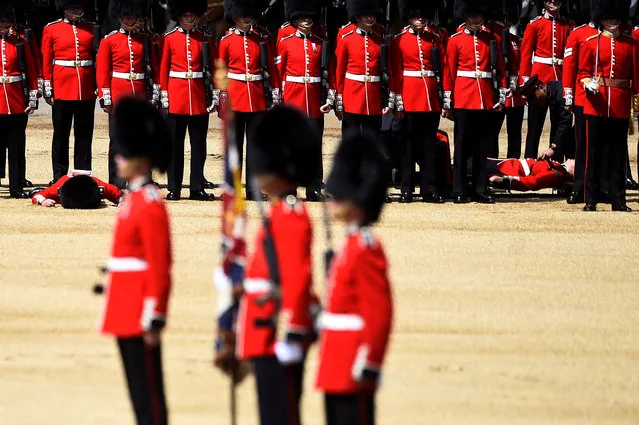 Guardsmen faint as the Household Division rehearse Trooping the Colour for the Colonel's Review ahead of the Queen's birthday parade next week, on Horseguards Parade in London, Britain, June 1, 2019. (Photo by Clodagh Kilcoyne/Reuters)