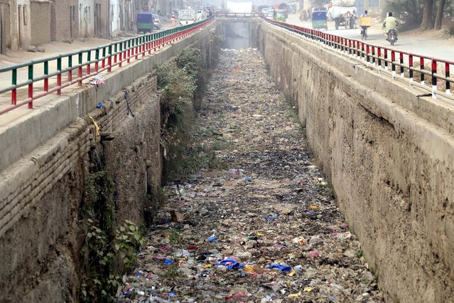 A general view of the sewerage drain on World Earth Day in Peshawar, Pakistan, 22 April 2024. World Earth Day is celebrated annually on 22 April, to raise awareness and develop a sense of public responsibility pertaining to environmentally-sustainable practices in order to build and maintain a healthy, global ecosystem and maintain a viable planet for future generations. The theme for World Earth Day 2024 is Planet vs Plastics, to bring attention to the serious issue of plastic pollution and how it harms nature. (Photo by Bilawal Arbab/EPA)