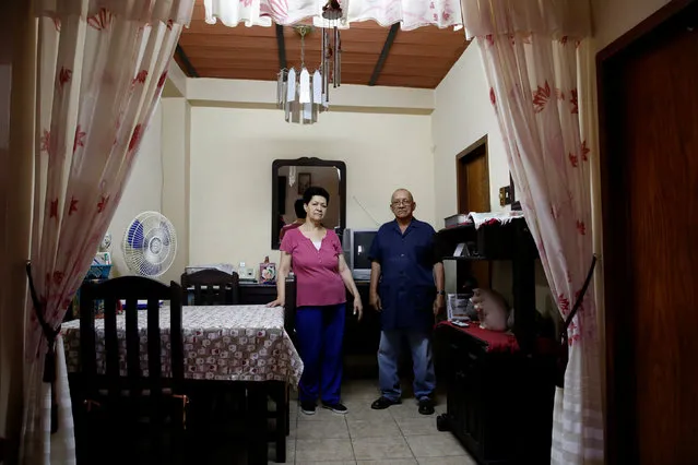 Romulo Bonalde (R) and his wife Maria de Bonalde pose for a picture at their home in Caracas, Venezuela April 23, 2016. “Before we were able to buy food for 15 days, now only we can cover our food needs for the day”, Bonalde said. (Photo by Carlos Garcia Rawlins/Reuters)