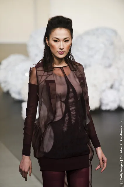 A model showcases designs by Jessie Wong on the catwalk during day one of Hong Kong Fashion Week
