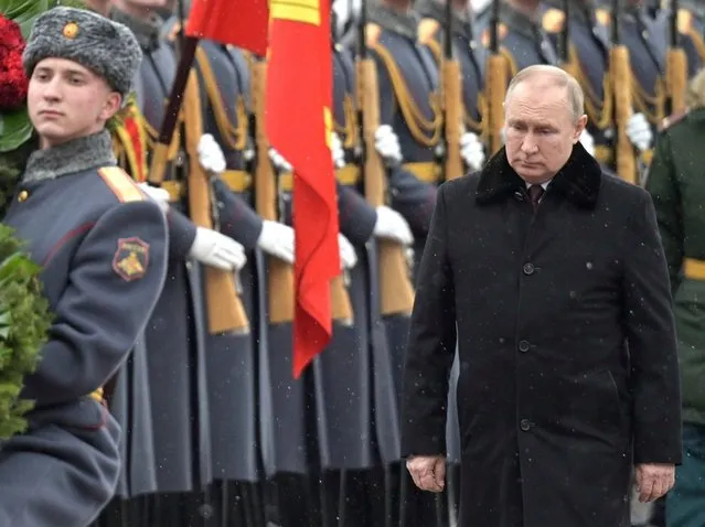 Russian President Vladimir Putin takes part in a wreath-laying ceremony at the Tomb of the Unknown Soldier at the Kremlin wall, February 23, 2022 in Moscow, Russia. The ceremony is part of the Defender of the Fatherland Day celebrations. (Photo by Alexei Nikolsky/Kremlin Pool/Alamy Live News)