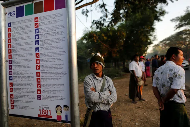 A man looks at a sign showing the bus routes for a new transport system at a bus stop in Yangon, Myanmar January 16, 2017. (Photo by Soe Zeya Tun/Reuters)