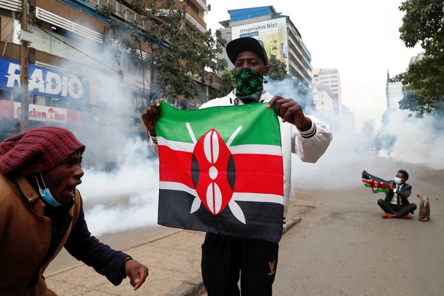 Protesters hold flags as they participate in an anti-government demonstration, following nationwide deadly riots over tax hikes and a controversial now-withdrawn finance bill, in Nairobi, Kenya, on July 16, 2024. (Photo by Thomas Mukoya/Reuters)