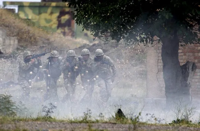 Georgian soldiers take part in a joint military exercise with NATO members, called “Agile Spirit 2015” at the Vaziani military base outside Tbilisi, Georgia, July 21, 2015. (Photo by David Mdzinarishvili/Reuters)