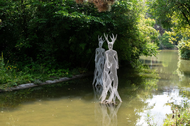 Installation of wiremesh works by Italian artist Carolina Capaccioli on the lake at Parc Montsouris in the 14th arrondissement of Paris, France, on July 1, 2024. (Photo by Riccardo Milani/Hans Lucas via AFP Photo)