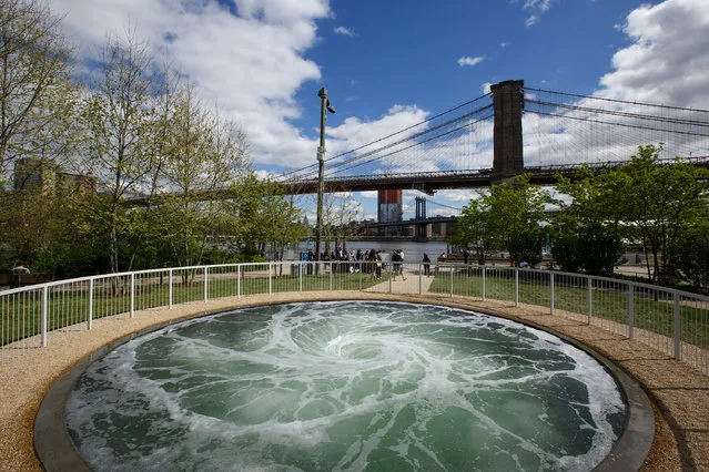 A view of artist Anish Kapoor's installation, titled “Descension”, in Brooklyn Bridge Park, May 3, 2017 in New York City. The installation will be on view through September 10. (Photo by Drew Angerer/Getty Images)