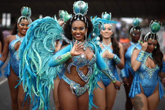 Performers in costume take part in the main parade of the Notting Hill Carnival in west London on August 27, 2023. (Photo by Henry Nicholls/AFP Photo)