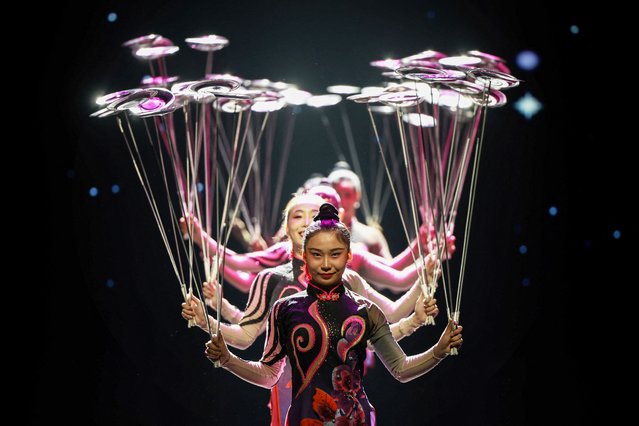 The photo taken on September 5, 2024 shows acrobats performing during a show at a theatre in Shenyang, in northeastern China's Liaoning province. (Photo by AFP Photo/China Stringer Network)