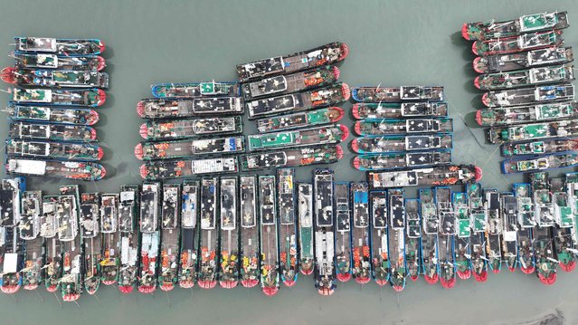 Fishing boats shelter in the port in Zhoushan, in China's easter Zhejiang province ahead of the arrival of Typhoon Bebinca on September 15, 2024. (Photo by AFP Photo/China Stringer Network)