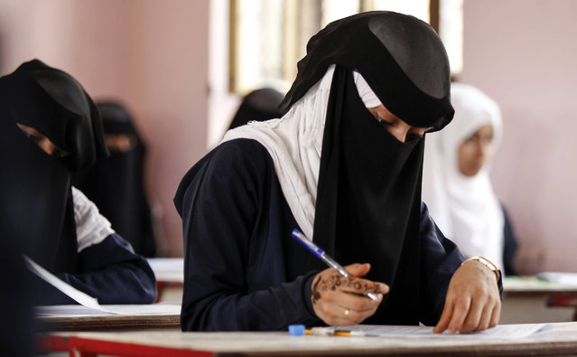 A female Yemeni students sits at a final exam in a secondary school in the capital Sanaa on July 8, 2017. (Photo by Mohammed Huwais/AFP Photo)