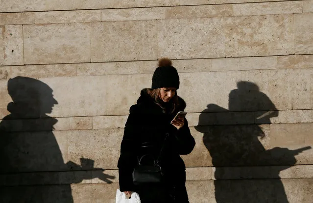 A woman uses her mobile phone in central Kiev, Ukraine December 13, 2016. (Photo by Valentyn Ogirenko/Reuters)