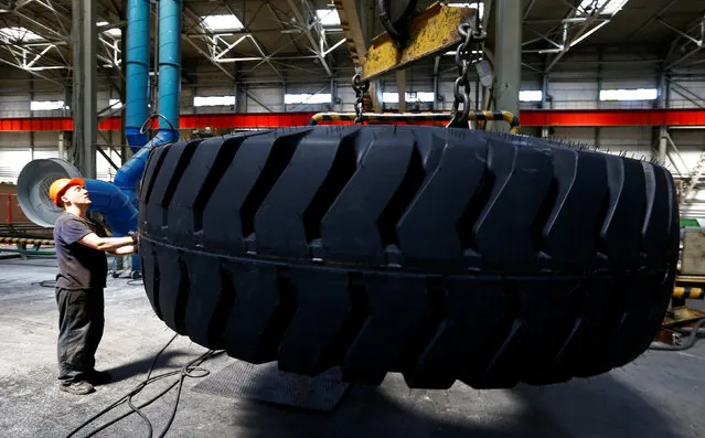 An employee works at Belshina tyre plant in Bobruisk, Belarus, June 30, 2016. (Photo by Vasily Fedosenko/Reuters)